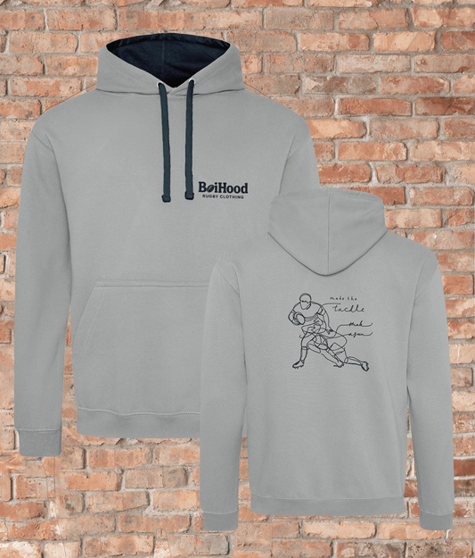 Men's 'Make The Tackle' hoodie by BoiHood, showcasing a comfortable design and stylish graphics on a brick background.